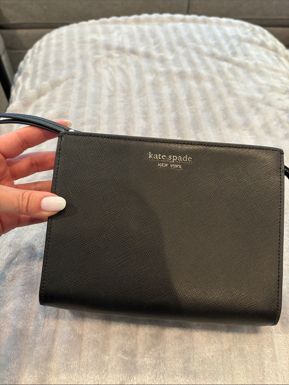 kate spade Black Leather Clutch with Wrist Strap and Gold Logo